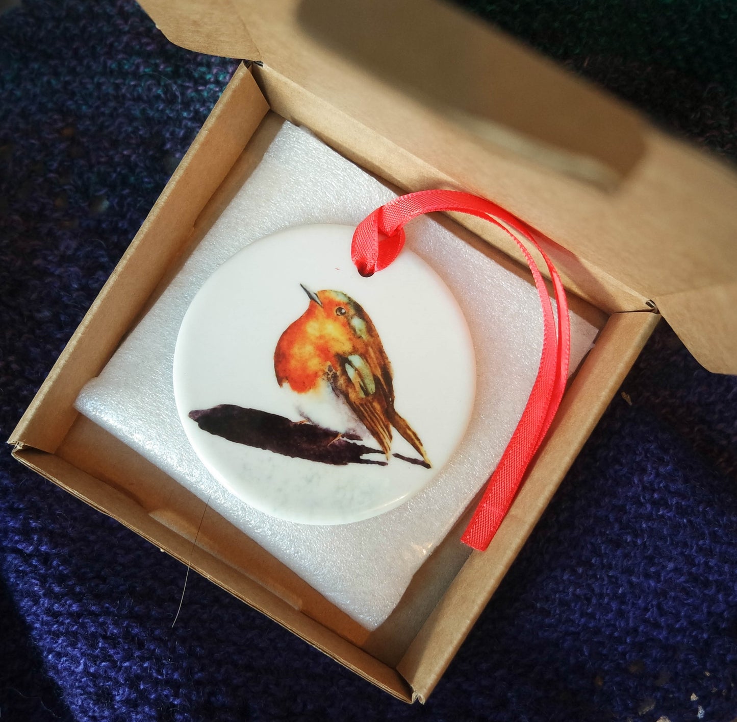 'Little Robin' a beautiful ceramic hanging decoration  with a red ribbon